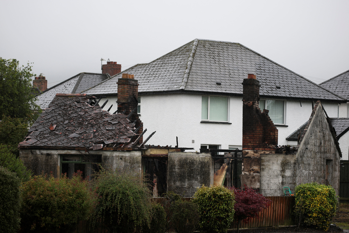 A burnt derelict house at Antrim Road, in the aftermath of anti-immigrant protests following a knife attack on June 8, which left a man seriously injured and prompted police to declare a critical incident, in Belfast, Northern Ireland, June 11, 2026. REUTERS/Isabel Infantes