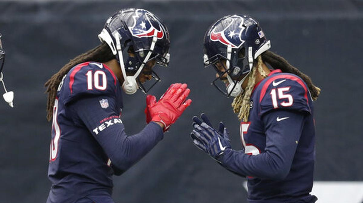 Houston Texans wide receiver Will Fuller (15) celebrates his touchdown with teammate DeAndre Hopkins (10) during the second half of an NFL football game against the Atlanta Falcons, Sunday, Oct. 6, 2019, in Houston.