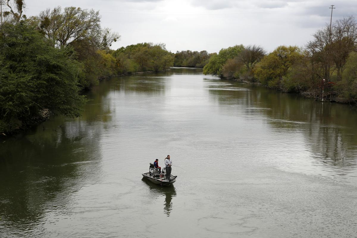  People fish in the Sacramento-San Joaquin River Delta’s Elk Slough near Courtland, California, in 2020. 