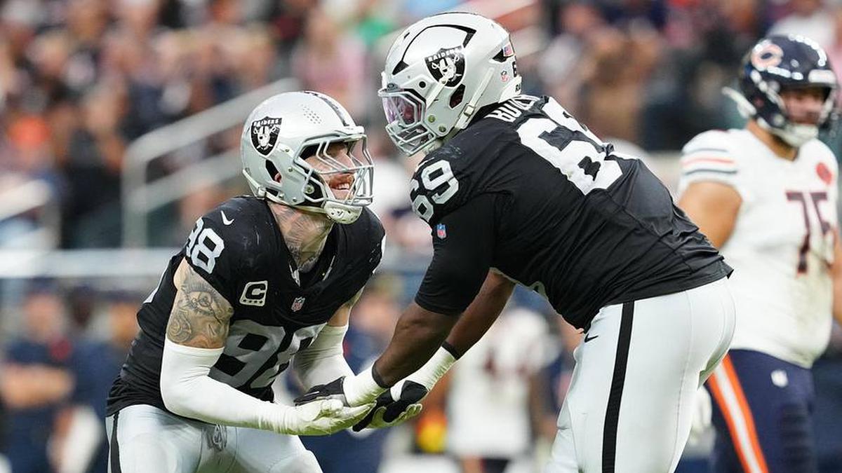  Sep 28, 2025; Paradise, Nevada, USA; Las Vegas Raiders defensive end Maxx Crosby (98) celebrates a play with defensive tackle Adam Butler (69) during the second half against the Chicago Bears at Allegiant Stadium. Mandatory Credit: Stephen R. Sylvanie-Imagn Images | Stephen R. Sylvanie-Imagn Images 