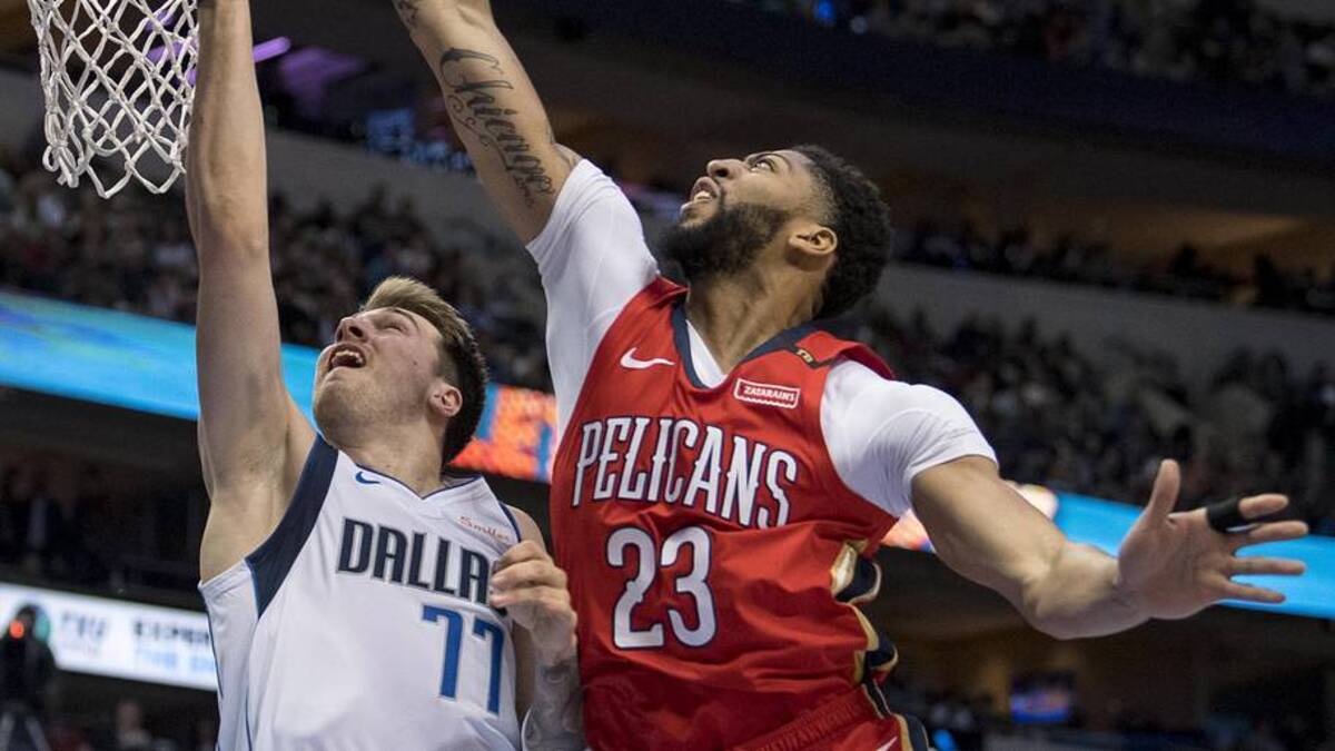  Mar 18, 2019; Dallas, TX, USA; Dallas Mavericks forward Luka Doncic (77) drives to the basket against New Orleans Pelicans forward Anthony Davis (23) during the second quarter at the American Airlines Center. Mandatory Credit: Jerome Miron-Imagn Images | Jerome Miron-Imagn Images 