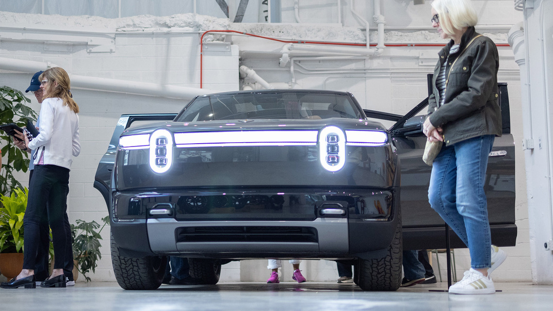 Rivian lays off hundreds of workers days after new vehicle deliveries begin 