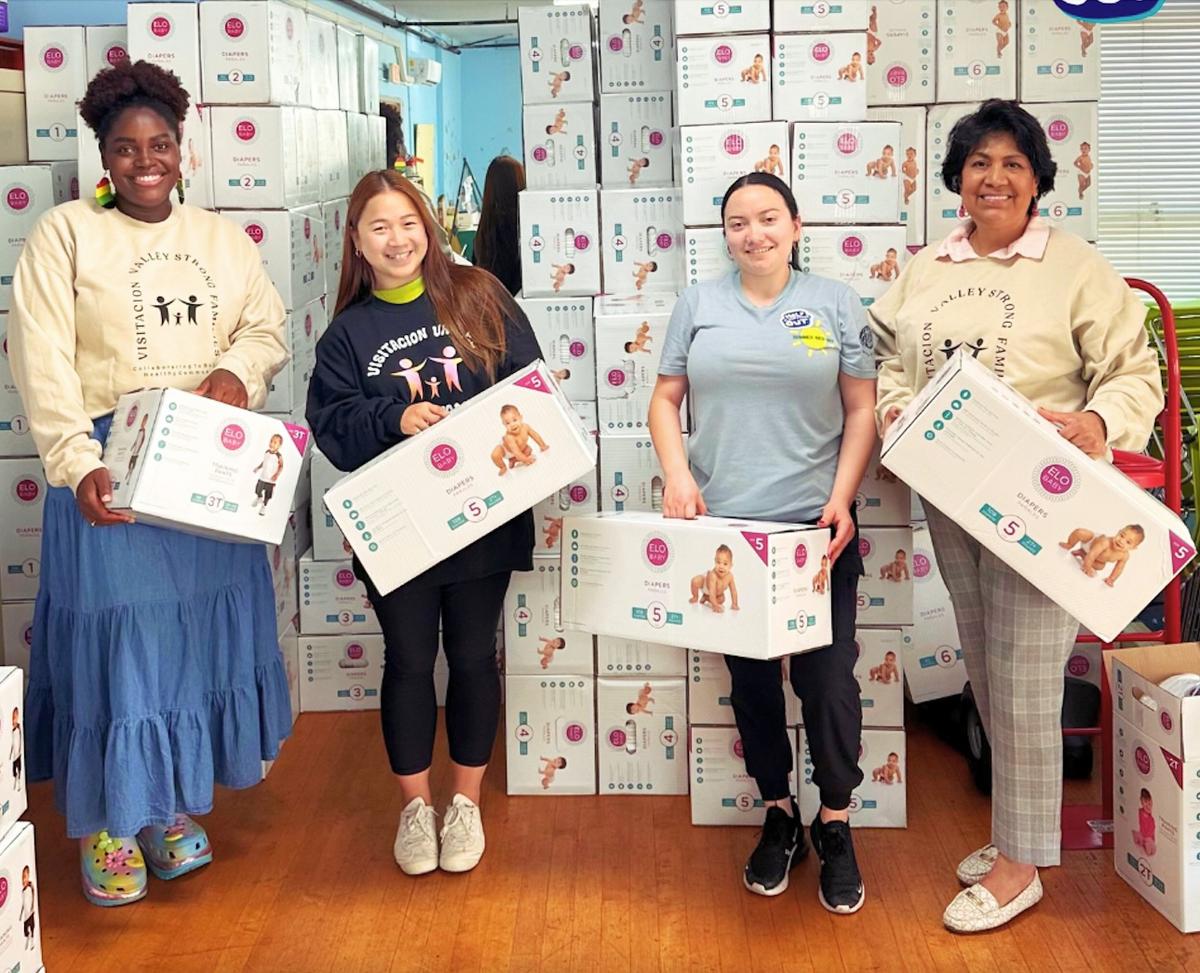 Volunteers help sort and store the diapersLisa Truong