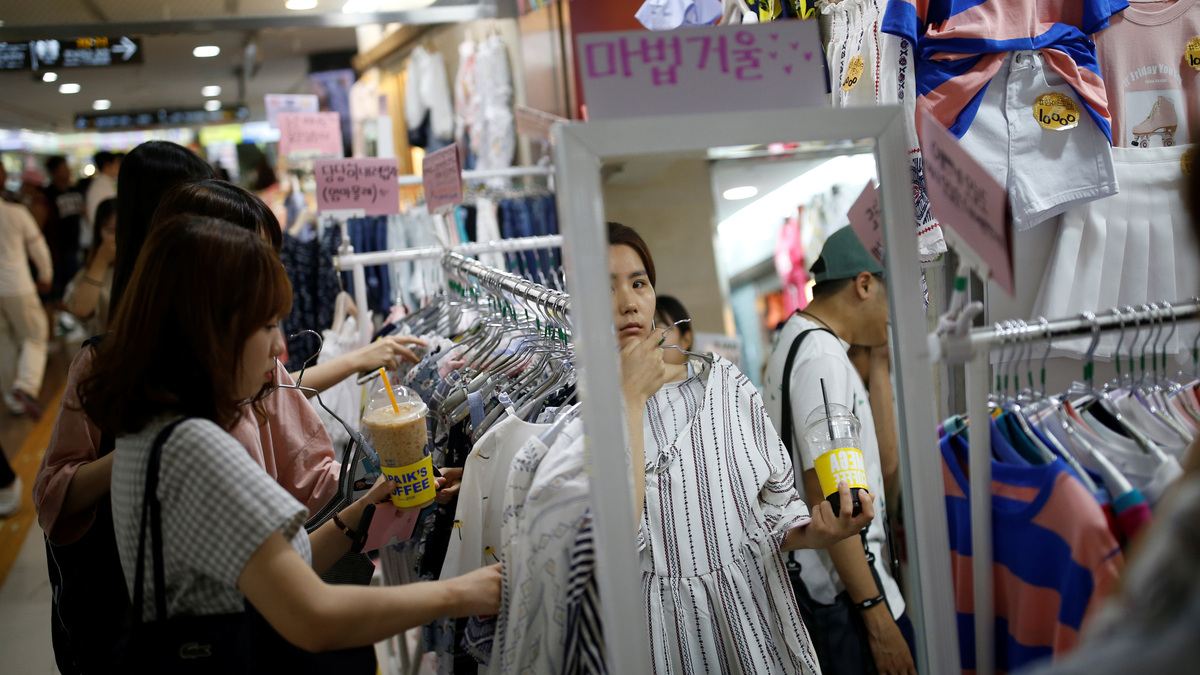 A woman shops at an underground shopping district in the Gangnam area of Seoul, South Korea, June 28, 2016. Picture taken June 28, 2016. REUTERS/Kim Hong-Ji