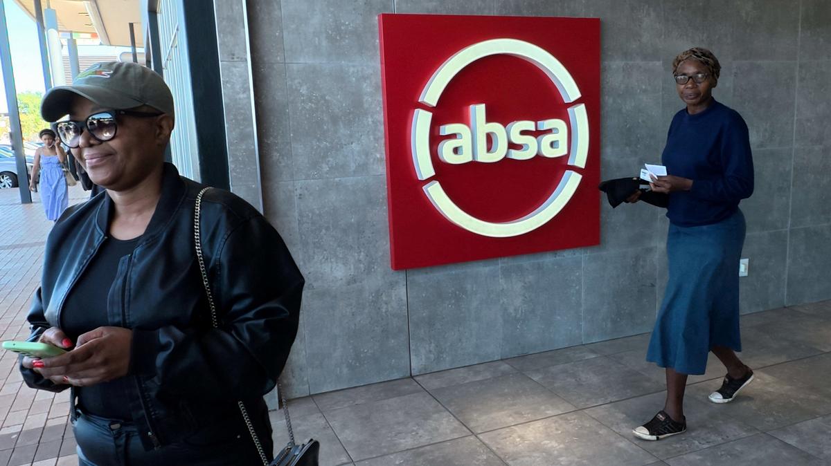 Shoppers walk past a logo of South African retail bank Absa at the Protea Glen Mall, in Soweto, South Africa, April 10, 2025. REUTERS/Siphiwe Sibeko