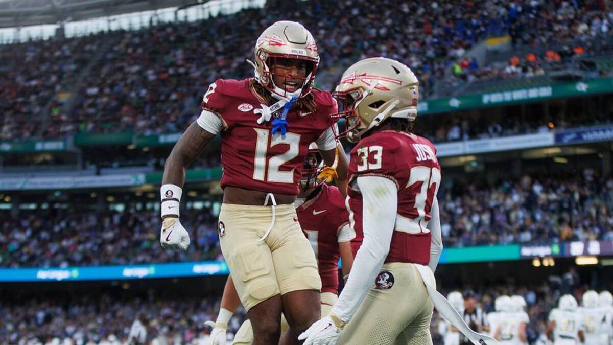  Aug 24, 2024; Dublin, IRL; Florida State University defensive back Edwin Joseph celebrates a tackle against Georgia Tech with defensive back Conrad Hussey at Aviva Stadium. Mandatory Credit: Tom Maher/INPHO via Imagn Images | Tom Maher/INPHO via Imagn Images 