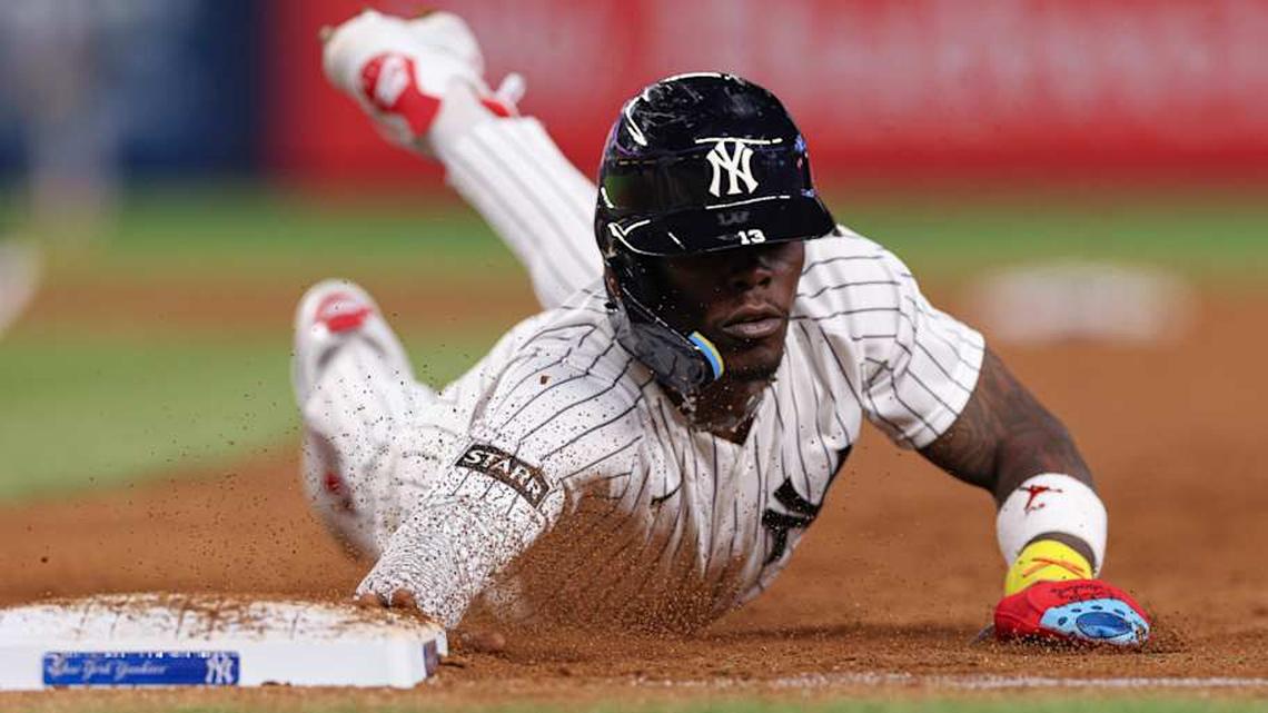  Apr 17, 2026; Bronx, New York, USA; New York Yankees second baseman Jazz Chisholm Jr. (13) slides back to first base on a pick off attempt during the seventh inning against the Kansas City Royals at Yankee Stadium. | Vincent Carchietta-Imagn Images 