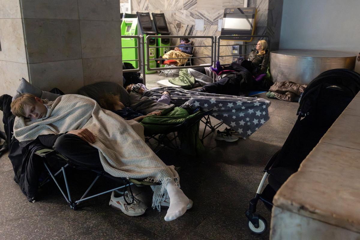 People shelter in a metro station during a Russian drone attack, amid Russia's attack on Ukraine, in Kyiv, Ukraine May 14, 2026. REUTERS/Thomas Peter