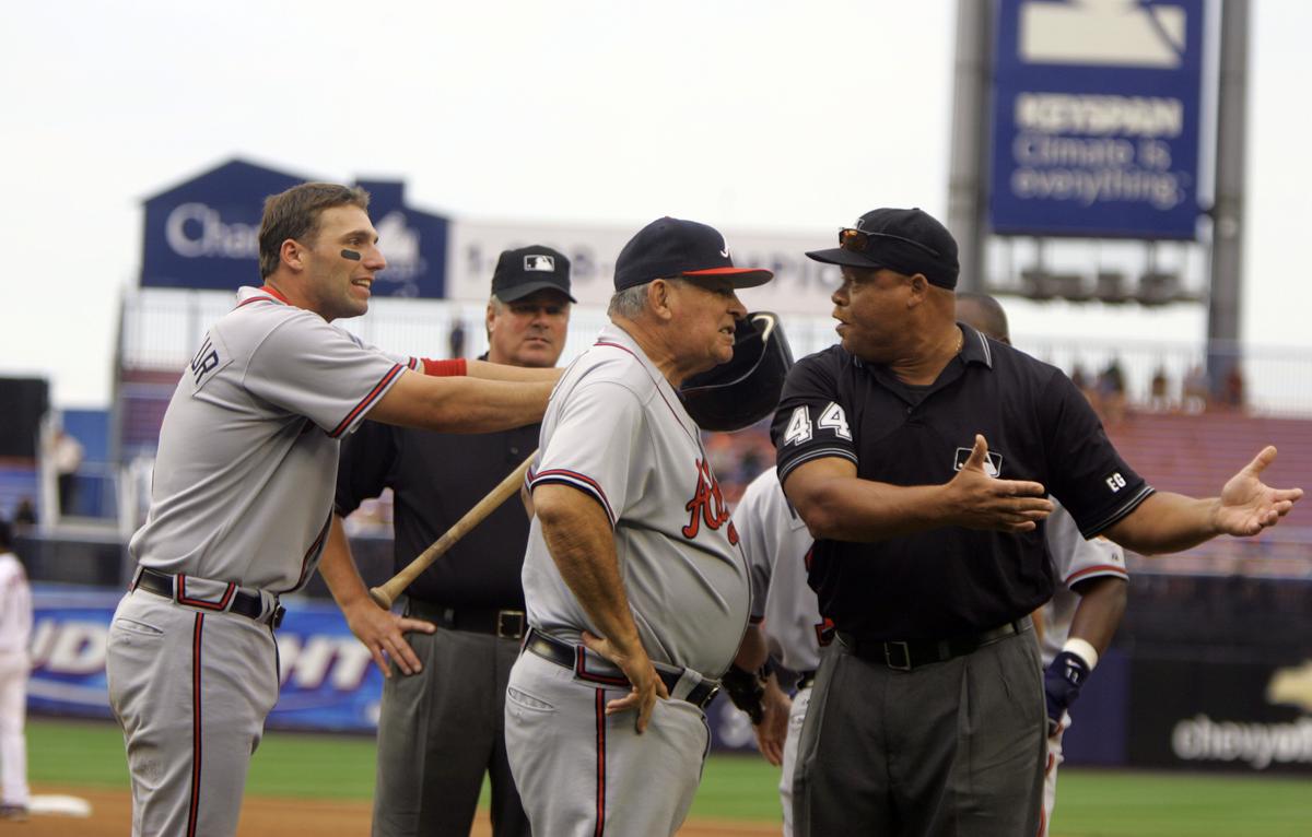 FILE-- The Atlanta Braves manager Bobby Cox and first baseman Jeff Francoeur argue a call with umpire Kerwin Danley during a doubleheader with the Mets at Shea Stadium in New York on Sept. 6, 2006. Cox, a Hall of Famer who led the Atlanta Braves to five National League pennants and a World Series championship and ranks No. 4 for career victories as a manager, died in Marietta, Ga. on May 9, 2026. He was 84. (Barton Silverman/New York Times)