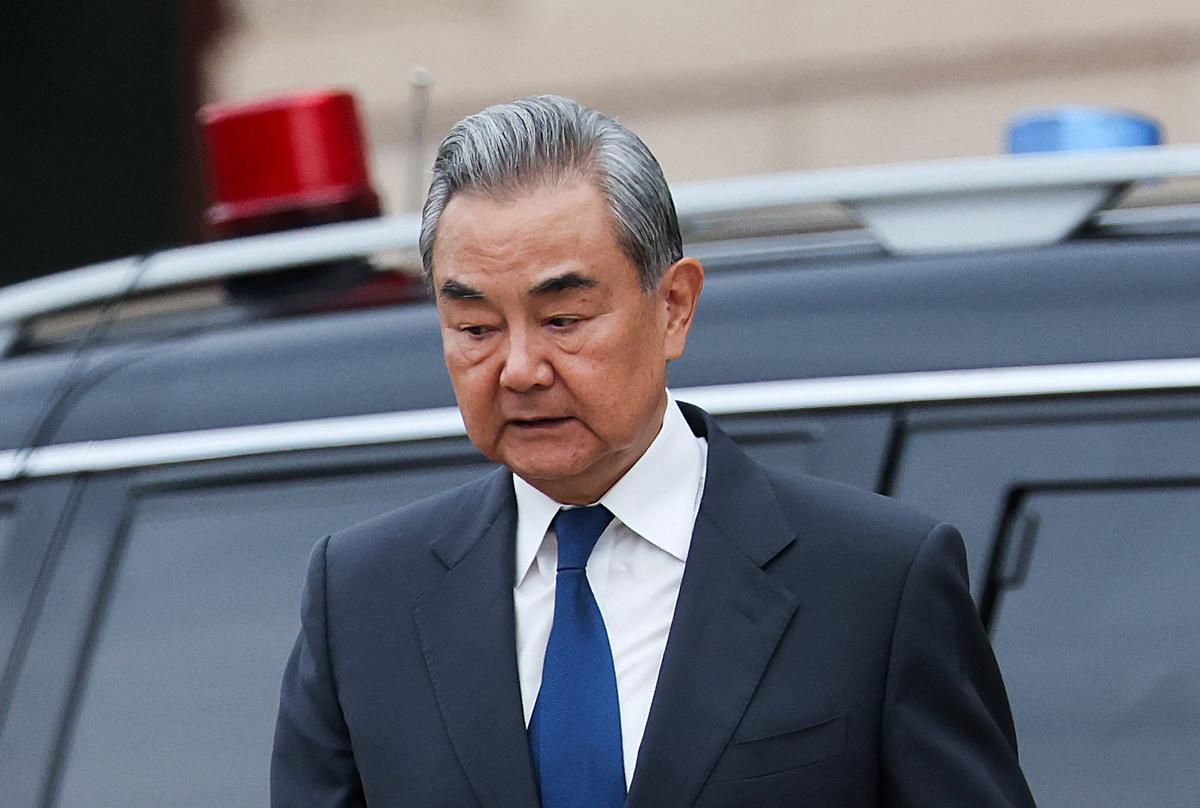 Chinese Foreign Minister Wang Yi leaves the Great Hall of the People in Beijing during Russian President Vladimir Putin visit to China, May 20, 2026. REUTERS/Maxim Shemetov/Pool