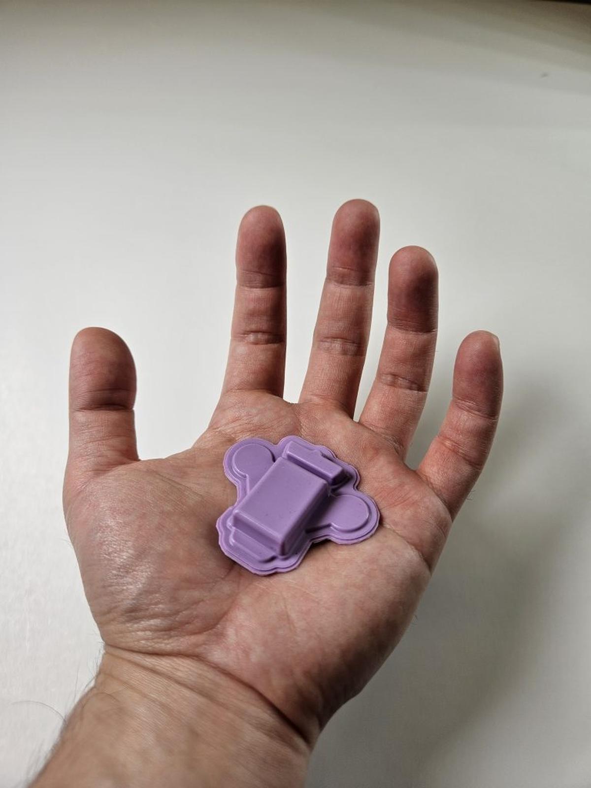  Wearable polygraph device in the palm of a hand for scale. (John A. Rogers / Northwestern University via SWNS) 