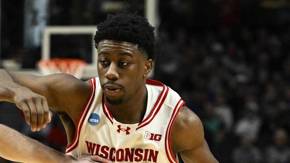  Mar 19, 2026; Portland, OR, USA; Wisconsin Badgers guard John Blackwell (25) drives against High Point Panthers guard Conrad Martinez (9) during the second half of a first round game of the men's 2026 NCAA Tournament at Moda Center. Mandatory Credit: Troy Wayrynen-Imagn Images | Troy Wayrynen-Imagn Images 
