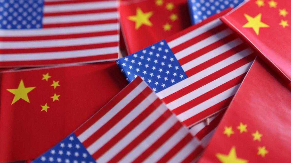 U.S. and Chinese flags are seen in this illustration taken March 20, 2025. REUTERS/Dado Ruvic/Illustration