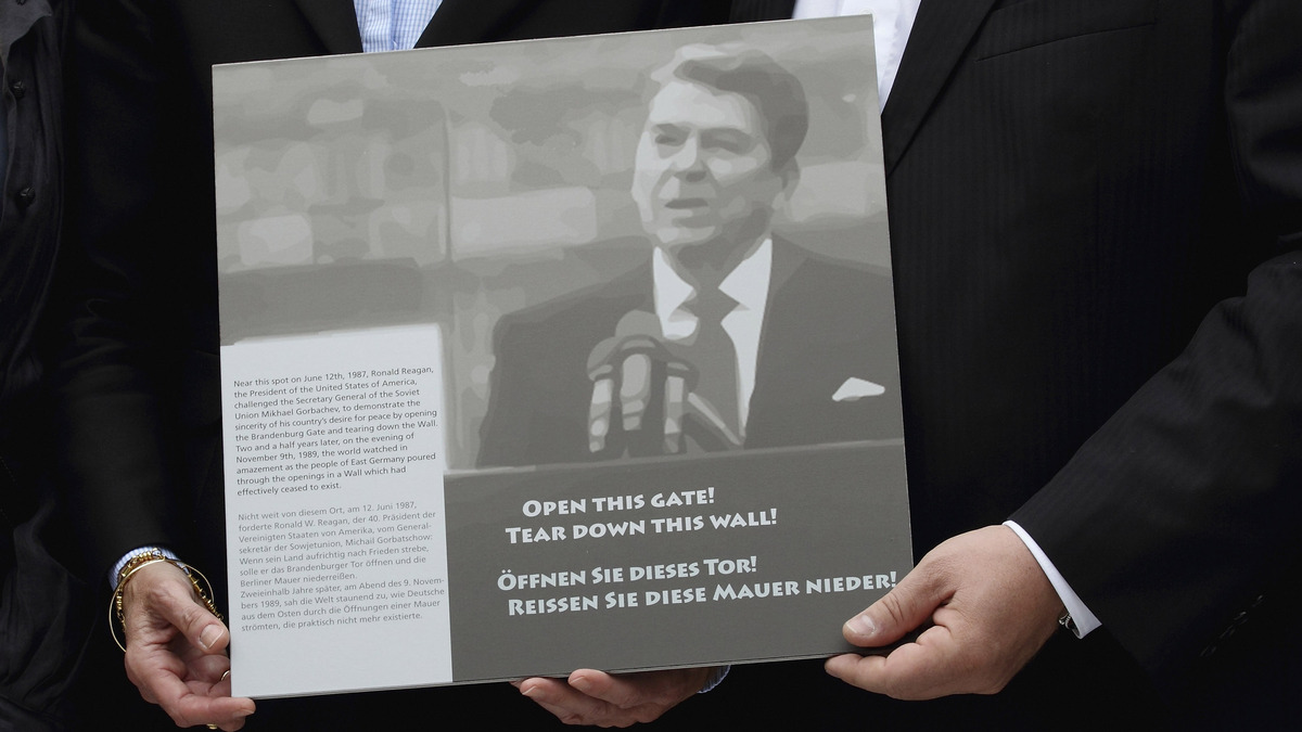 A portrait of former U.S. President Ronald Regan is pictured as U.S. ambassador to Germany Philip Murphy (not pictured) speaks during a ceremony for former U.S. President Ronald Regan at the U.S. embassy on June 12, 2012, in Berlin, Germany. Reagan's speech during the 750th anniversary of Berlin on June 12, 1987, 'Tear down this wall!' was the famous command to Soviet leader Mikhail Gorbachev to destroy the Berlin Wall.  (Andreas Rentz/Getty Images/TNS)