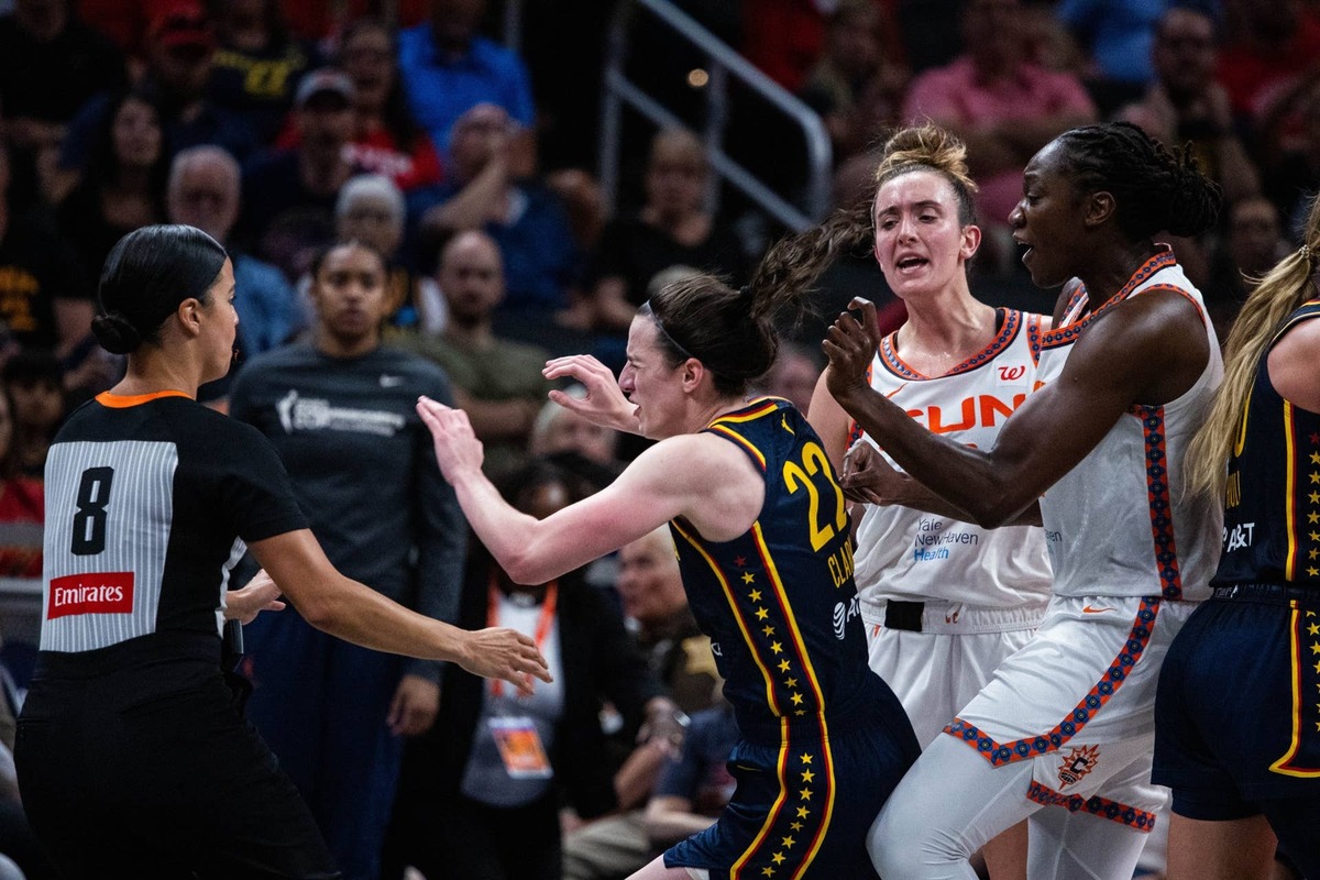  Connecticut Sun guard Marina Mabrey pushes Indiana Fever guard Caitlin Clark Trevor Ruszkowski-Imagn Images