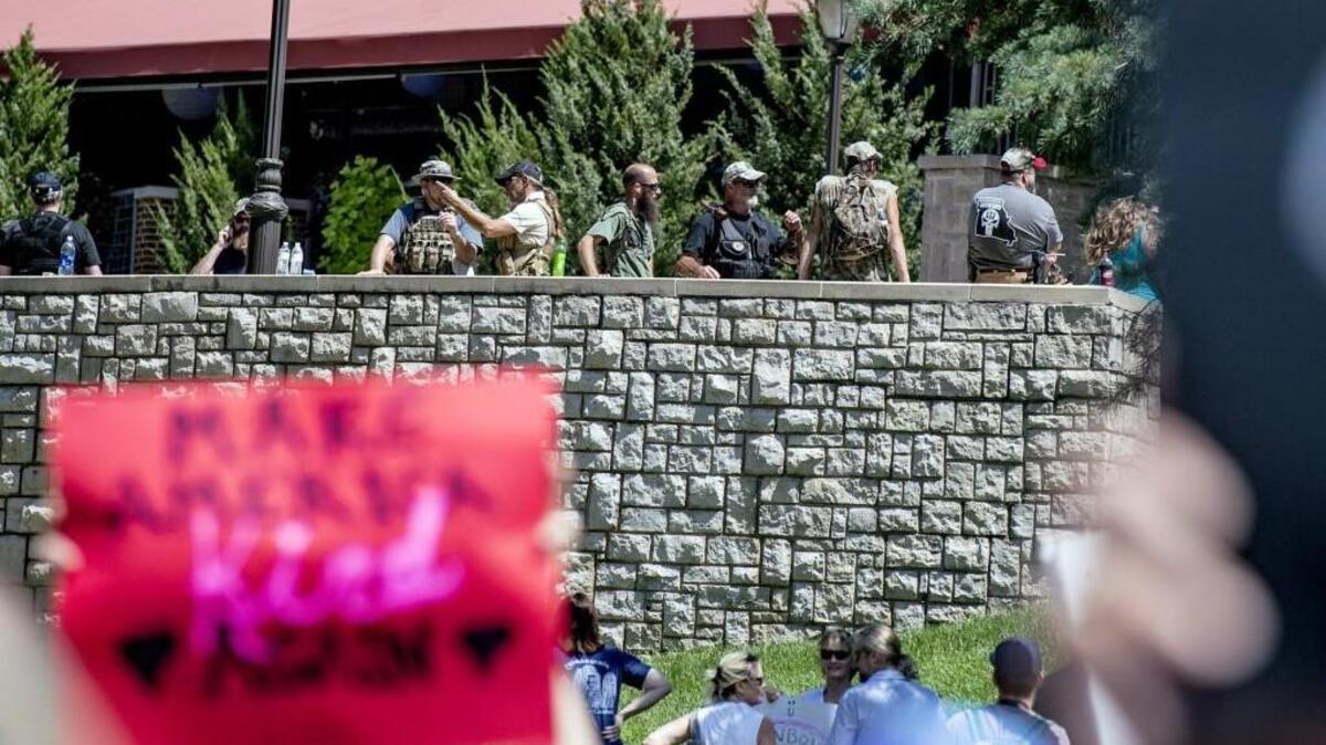Three Percenters watch on Sunday, Aug. 20, at an anti-hate rally at the Country Club Plaza.