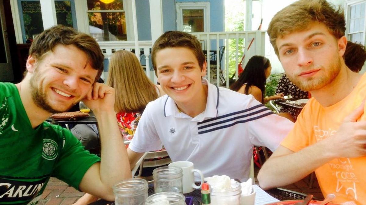 Otto Warmbier, left, with friends Emmett Saulnier, center, and Ned Ende in May 2015.