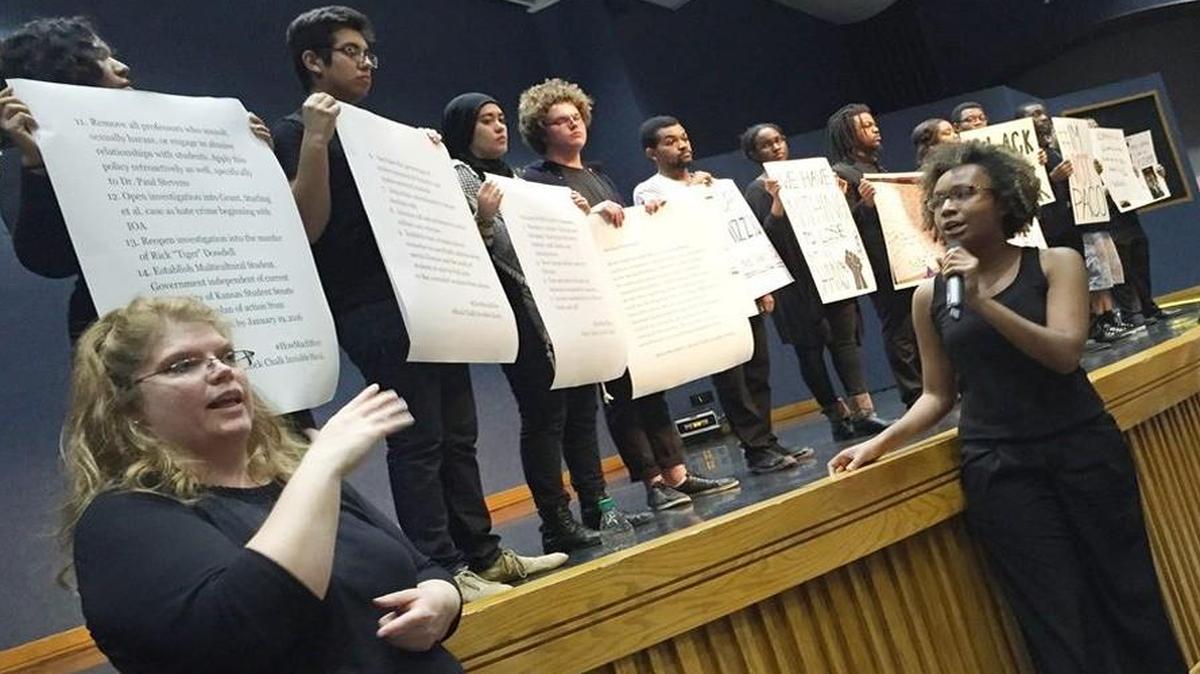 A student group called Rock Chalk Invisible Hawk has held protests at the University of Kansas in Lawrence. At one recent protest, demonstrators held signs listing 15 demands.