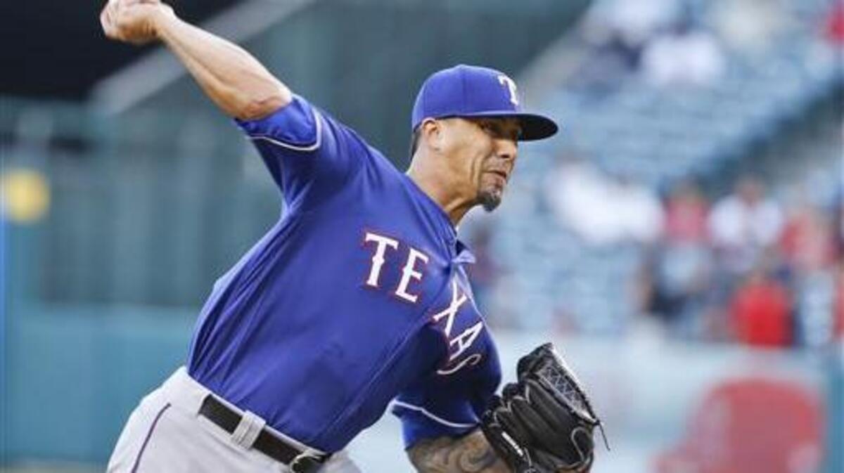 Texas Rangers starting pitcher Kyle Lohse works against the Los Angeles Angels in the first inning of a baseball game Tuesday, July 19, 2016, in Anaheim, Calif.