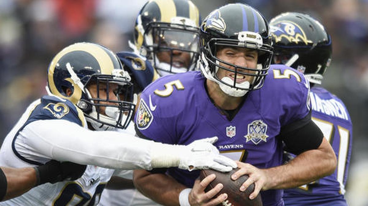 FILE - In this Nov. 22, 2015, file photo, Baltimore Ravens quarterback Joe Flacco (5) is sacked by St. Louis Rams defensive tackle Aaron Donald (99) during the first half of an NFL football game in Baltimore. Arizona Cardinals quarterback Carson Palmer said the Rams’ defense, with the likes of Donald, Alec Ogletree and Robert Quinn, ``is as good as it gets.’’