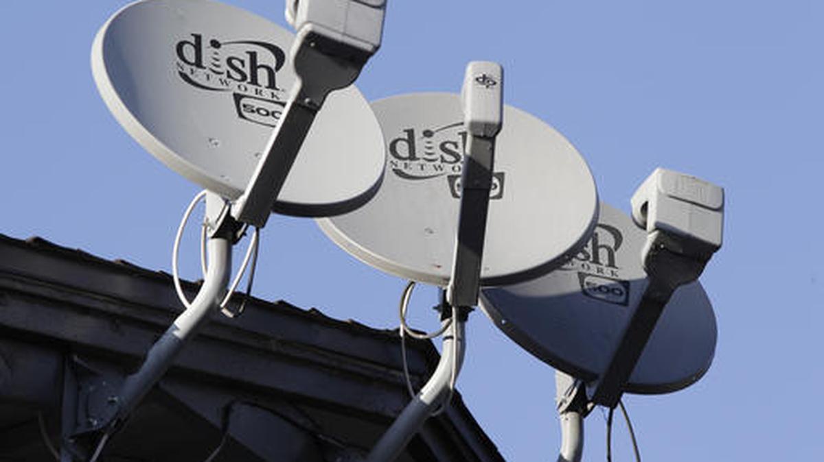 In this file photo, Dish Network satellite dishes are shown at an apartment complex in Palo Alto.